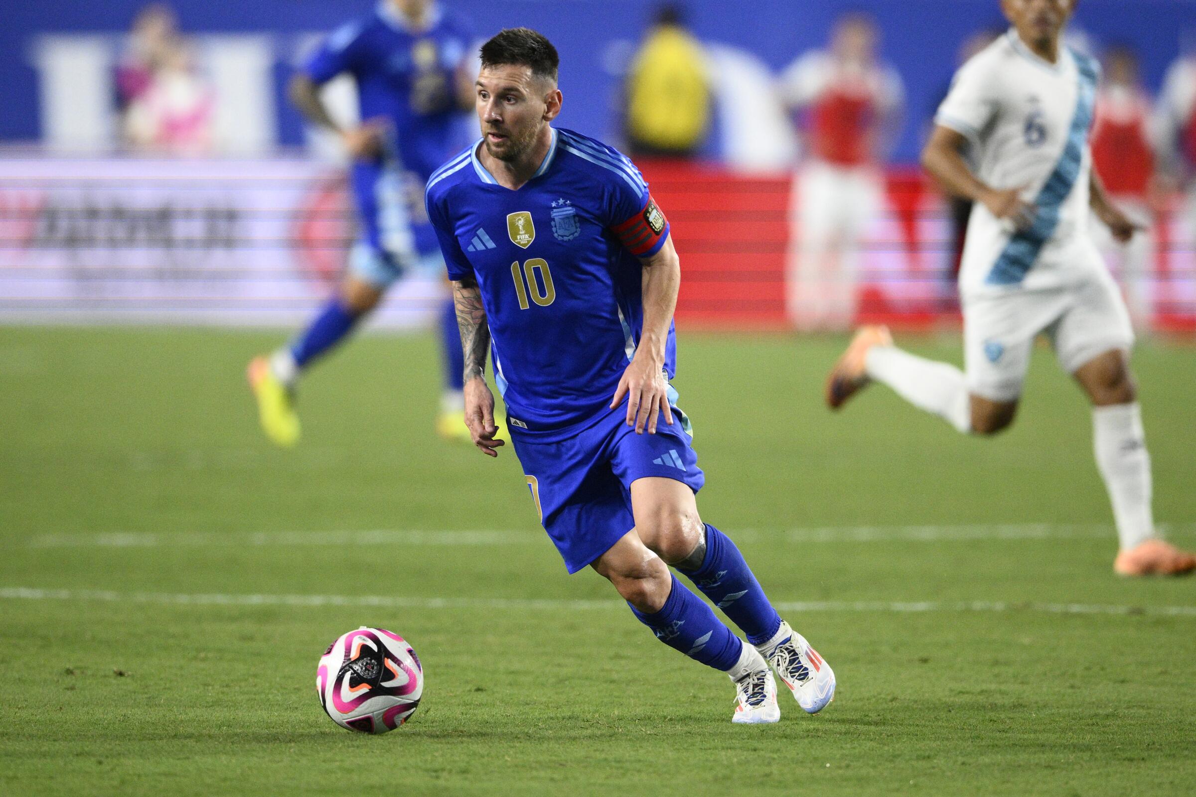 Argentina forward Lionel Messi controls the ball during an international friendly match against Guatemala.