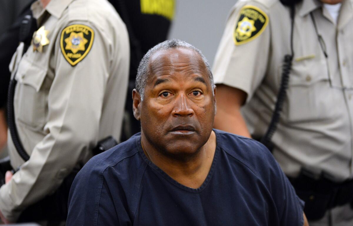O.J. Simpson attends a 2013 evidentiary hearing in Clark County District Court in Las Vegas. Simpson is serving nine to 33 years in prison for his 2008 conviction in the armed robbery of two sports memorabilia dealers in a Vegas hotel room.