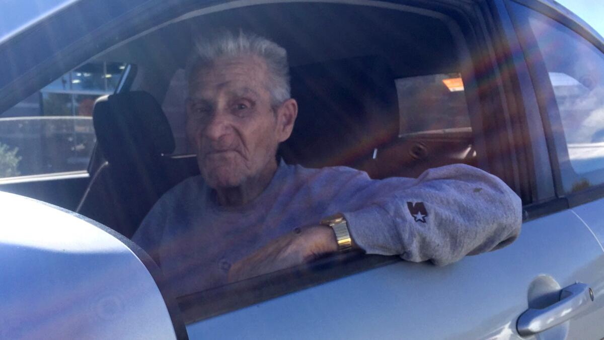 Doyle MacCree, 84, listens to Rush Limbaugh's national radio show in the parking lot of a Goodyear, Ariz., mall.