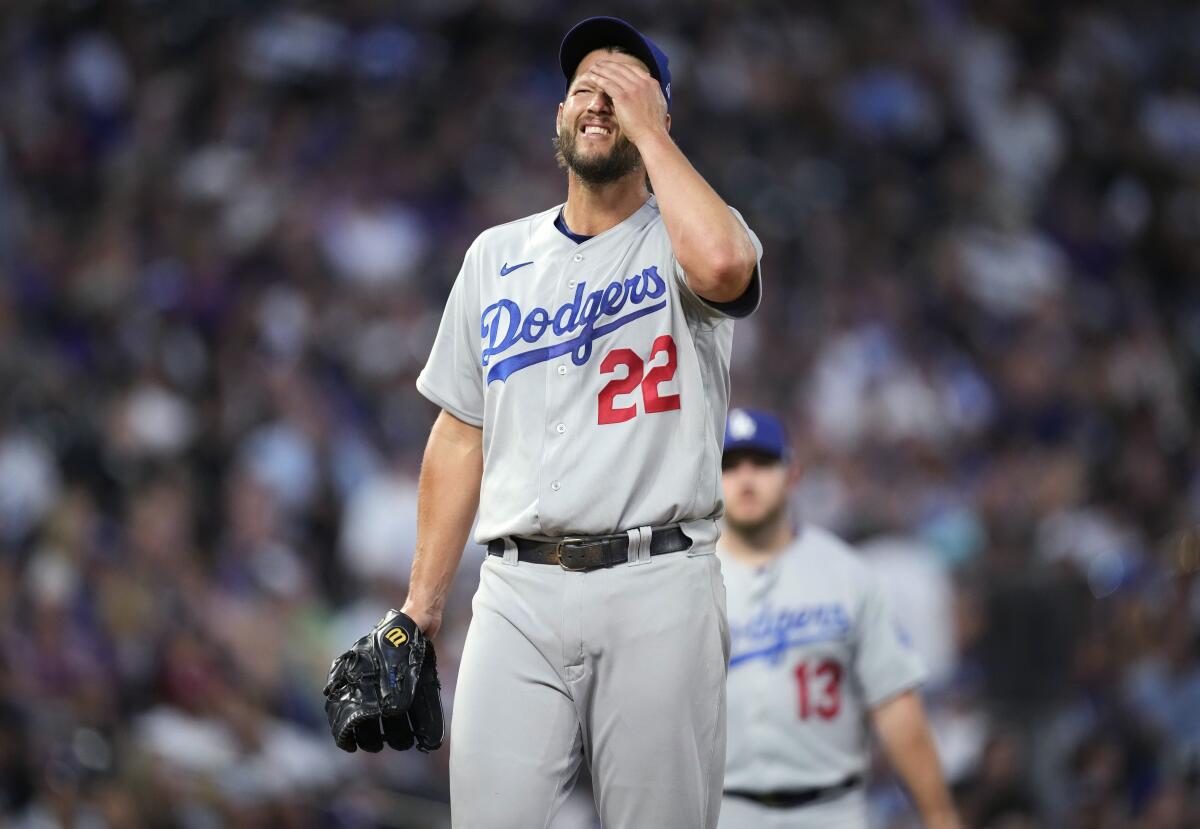 Dodgers starting pitcher Clayton Kershaw reacts after giving up a two-run triple to Colorado's Randal Grichuk.