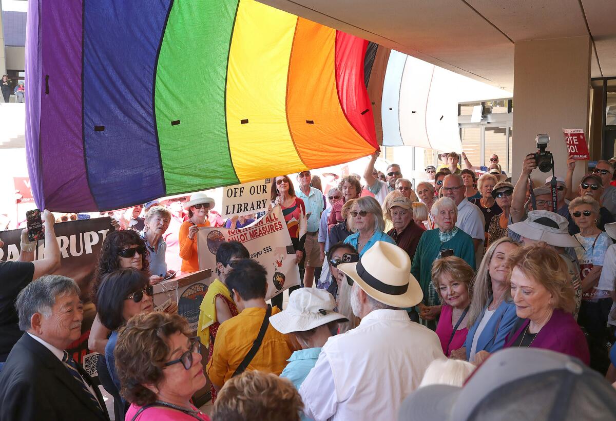 Vocal members and supporters of Protect Huntington Beach gather for a question and answer session on Wednesday.