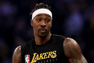 Lakers forward Dwight Howard warms up before a game.