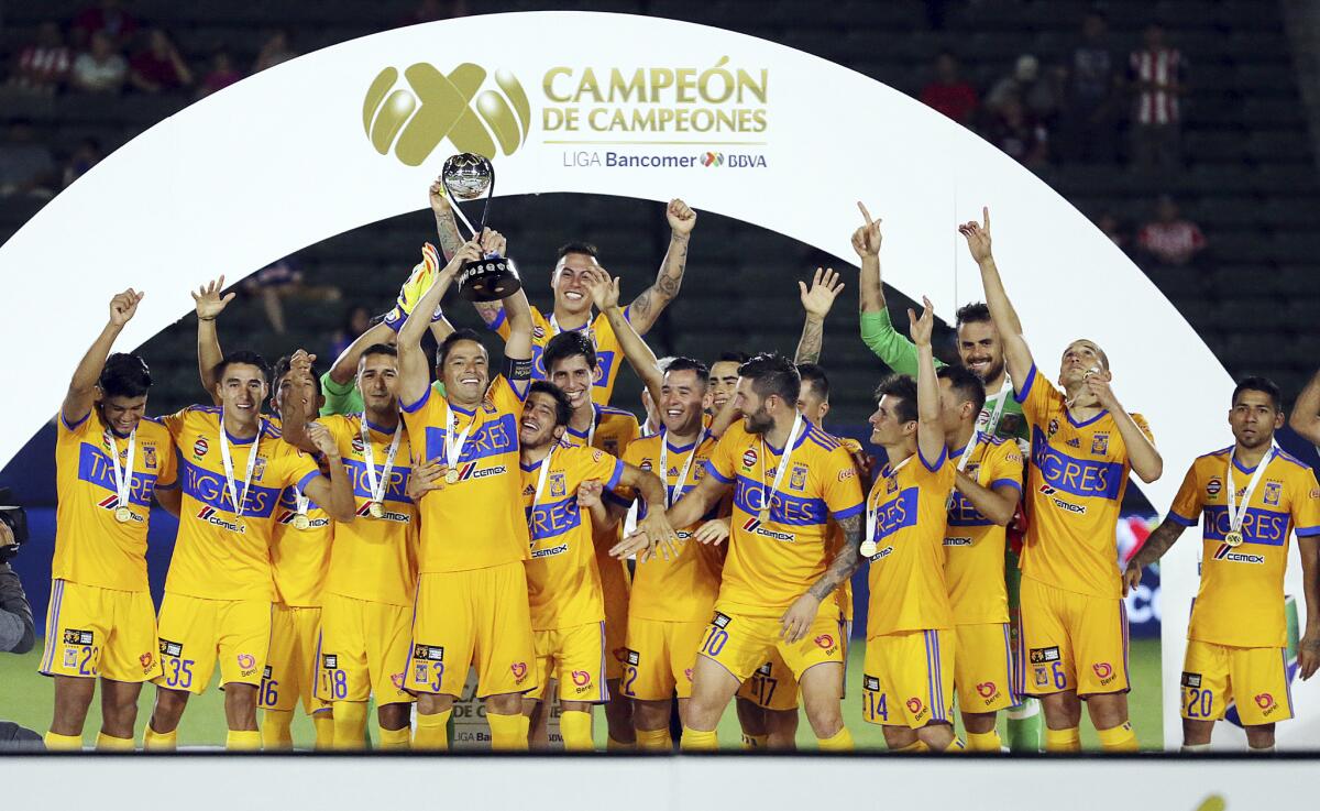 Tigres UANL celebrates their victory over Chivas de Guadalajara in the Champion of Champions (Campeón de Campeones) soccer match in Carson, Calif., Sunday, July 16, 2017. The Tigres won, 1-0. (AP Photo/Reed Saxon)
