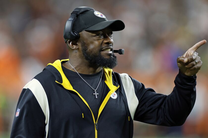 Pittsburgh Steelers coach Mike Tomlin questions an official during the second half of the team's NFL football game against the Cleveland Browns in Cleveland, Thursday, Sept. 22, 2022. The Browns won 29-17. (AP Photo/Ron Schwane)