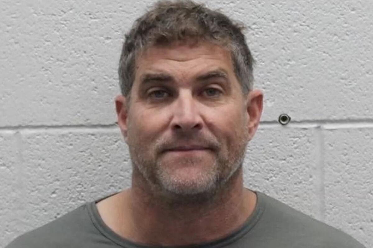 A booking photo of a man.