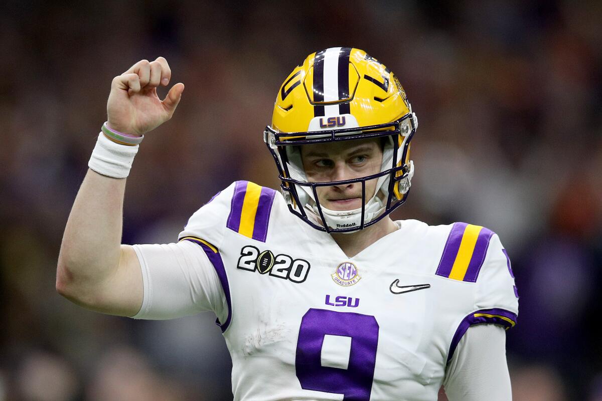 Louisiana State's Joe Burrow reacts after a touchdown against Clemson in the College Football Playoff title game. 