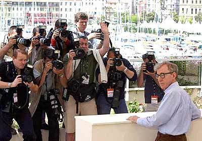 Woody Allen tolerates a photo call.