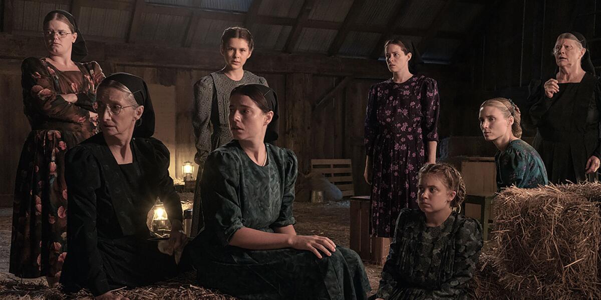 Mennonite women gather in a barn to discuss their future in the colony after horrific abuse in "Women Talking."