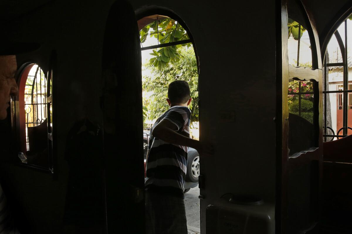 In El Salvador, Mauricio Gomez was living in fear, separated from his parents in the U.S.
