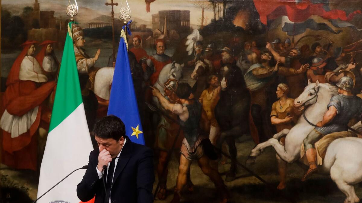 Italian Premier Matteo Renzi pauses as he speaks during a news conference at the premier's office in Palazzo Chigi on Dec. 5, 2016.