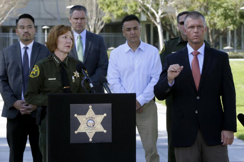 Orange County Sheriff Sandra Hutchens, left, at a news conference Jan. 29 in Santa Ana, said the escape of three jail inmates was an embarrassment for her department.