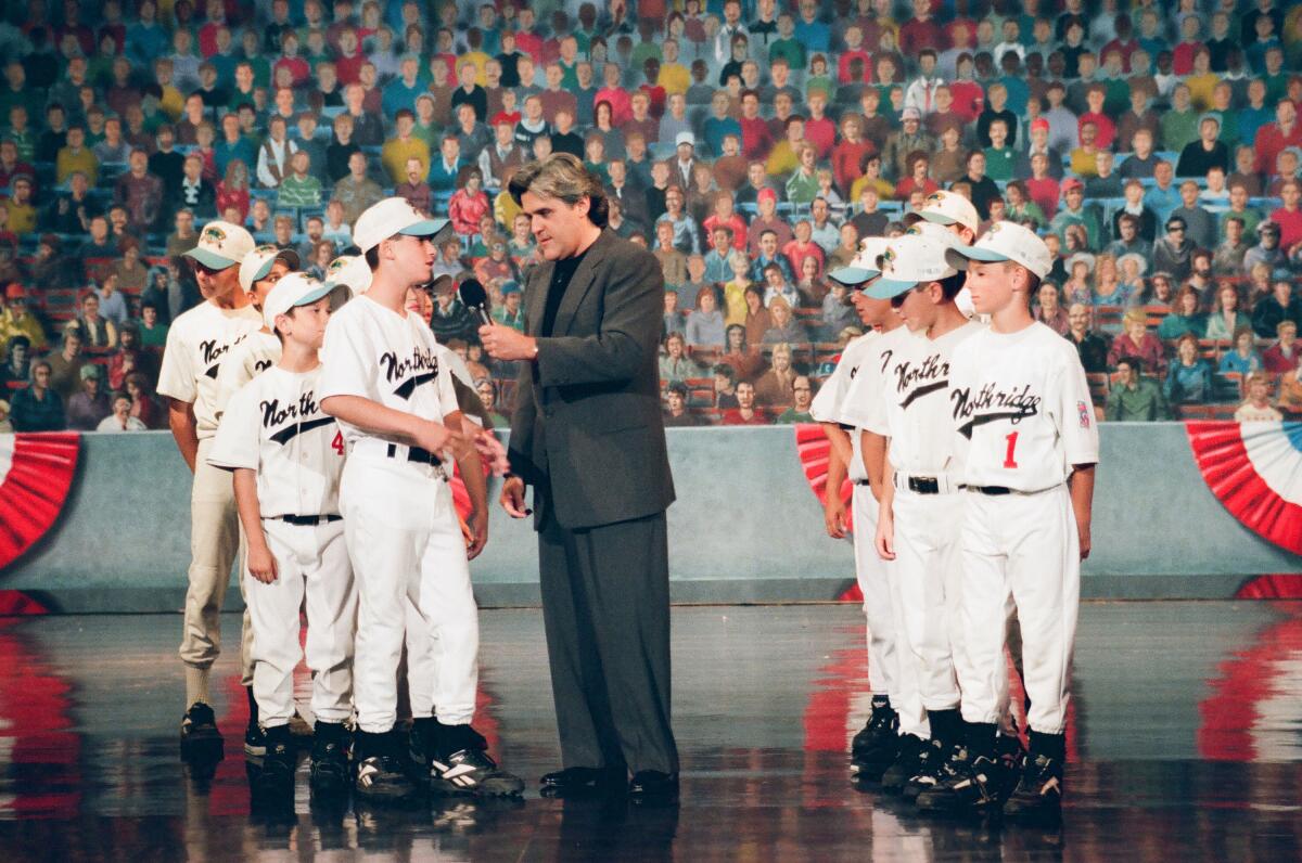 Talk show host Jay Leno interviews the Northridge Little League players on Sept. 5, 1994.