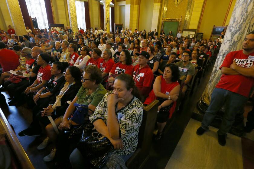 An overflow crowd fills the L.A. City Council chamber Thursday as the Planning Commission considered imposing new regulations on Airbnb and other websites.