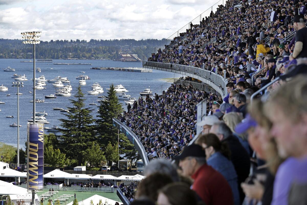 Boats are moored in Lake Washington just outside Husky Stadium as fans watch Washington play Stanford on Sept. 27, 2014.