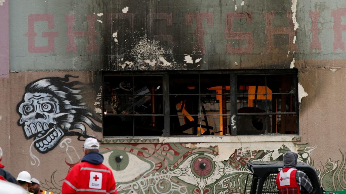 Red Cross workers outside the Ghost Ship warehouse Dec. 7.