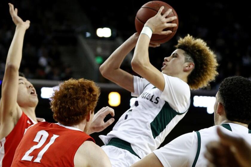 Chino Hills guard LaMelo Ball pulls up for a shot over Mater Dei’s Michael Wang and Matthew Weyand (21).