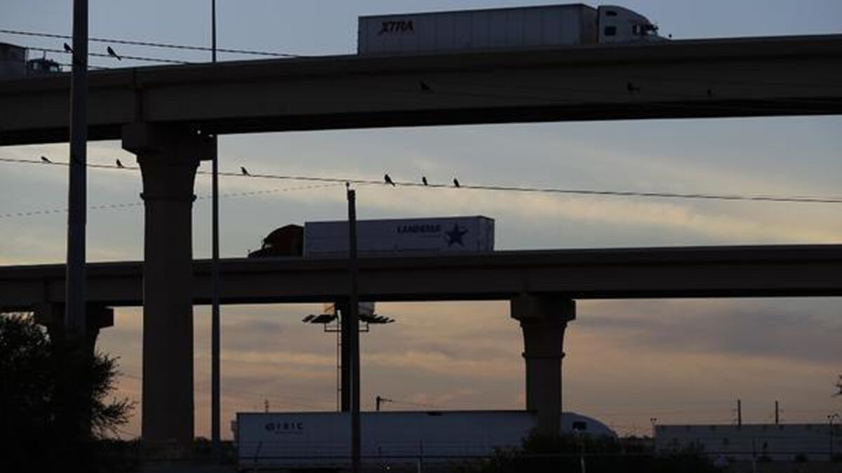 Trucks travel to and from the World Trade Bridge in Laredo, Texas, on the U.S.-Mexico border.