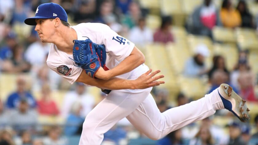 Dodgers pitcher Walker Buehler throws a pitch against the Atlanta Braves in the first inning at Dodger Stadium on June 8.