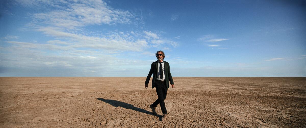 Daniel Giménez Cacho walks in a barren desert in "Bardo: False Chronicle of a Handful of Truths"