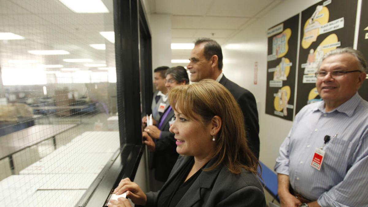 Patty Lopez watches as ballots are counted in her 2014 race against then-incumbent Raul Bocanegra, who she bested by fewer than 500 votes.