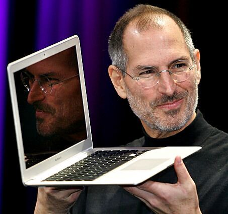 Jobs shows off the new Macbook Air, a small, light laptop, during his keynote speech at the 2008 MacWorld conference in San Francisco. Almost exactly one year later, Jobs announced that he would take a medical leave of absence from Apple through June, saying his health issues were "more complex than I originally thought."