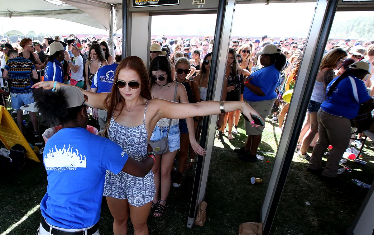 Crowds of people await entry at the Coachella Music and Arts Festival.