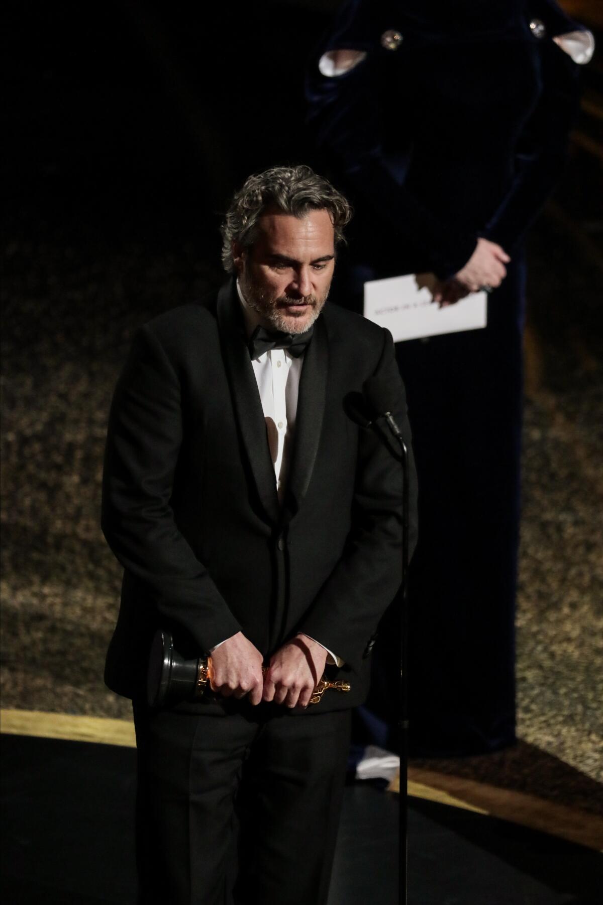 Joaquin Phoenix, accepts the lead actor Oscar for “Joker.”