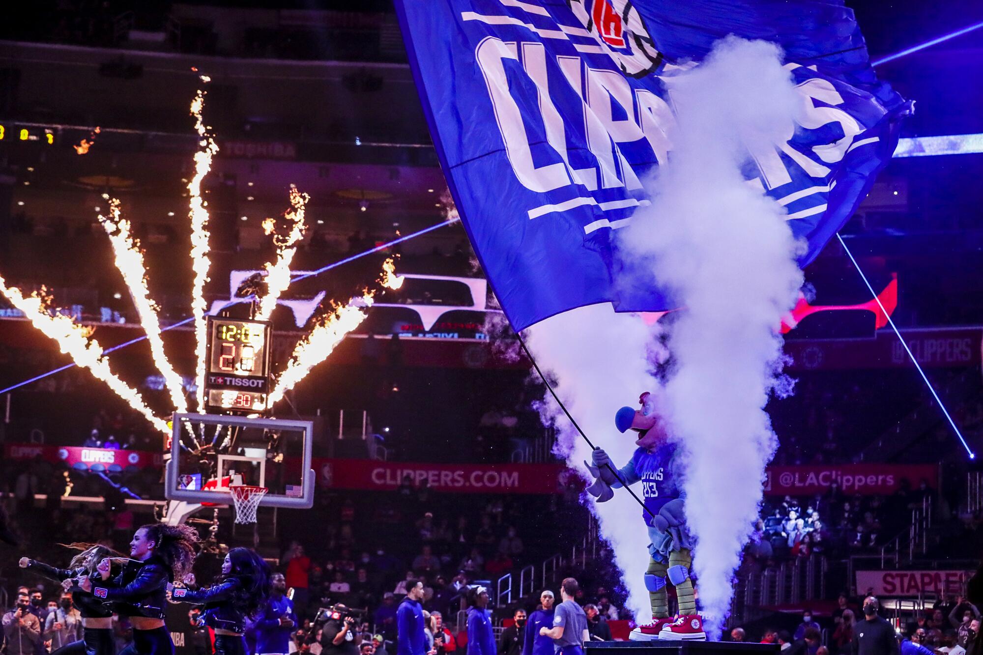 Chuck the Condor waves a banner midcourt during pregame festivities for a Clippers-Trail Blazers game in 2021.