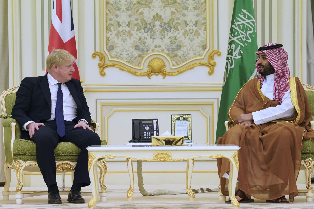 Britain's Prime Minister Boris Johnson, left, sits with Mohammed bin Salman, right, Crown Prince of Saudi Arabia ahead of a meeting at the Royal Court in Riyadh, Saudia Arabia, Wednesday March 16, 2022. Johnson arrived in the Gulf for meetings in the United Arab Emirates and Saudi Arabia aimed at easing skyrocketing gasoline prices as the West grapples with economic headwinds from Russia’s war in Ukraine. Johnson will be seeking greater investments in the U.K.’s renewable energy transition and ways to secure more oil to lessen British dependence on Russian energy supplies. (Stefan Rousseau/Pool Photo via AP)