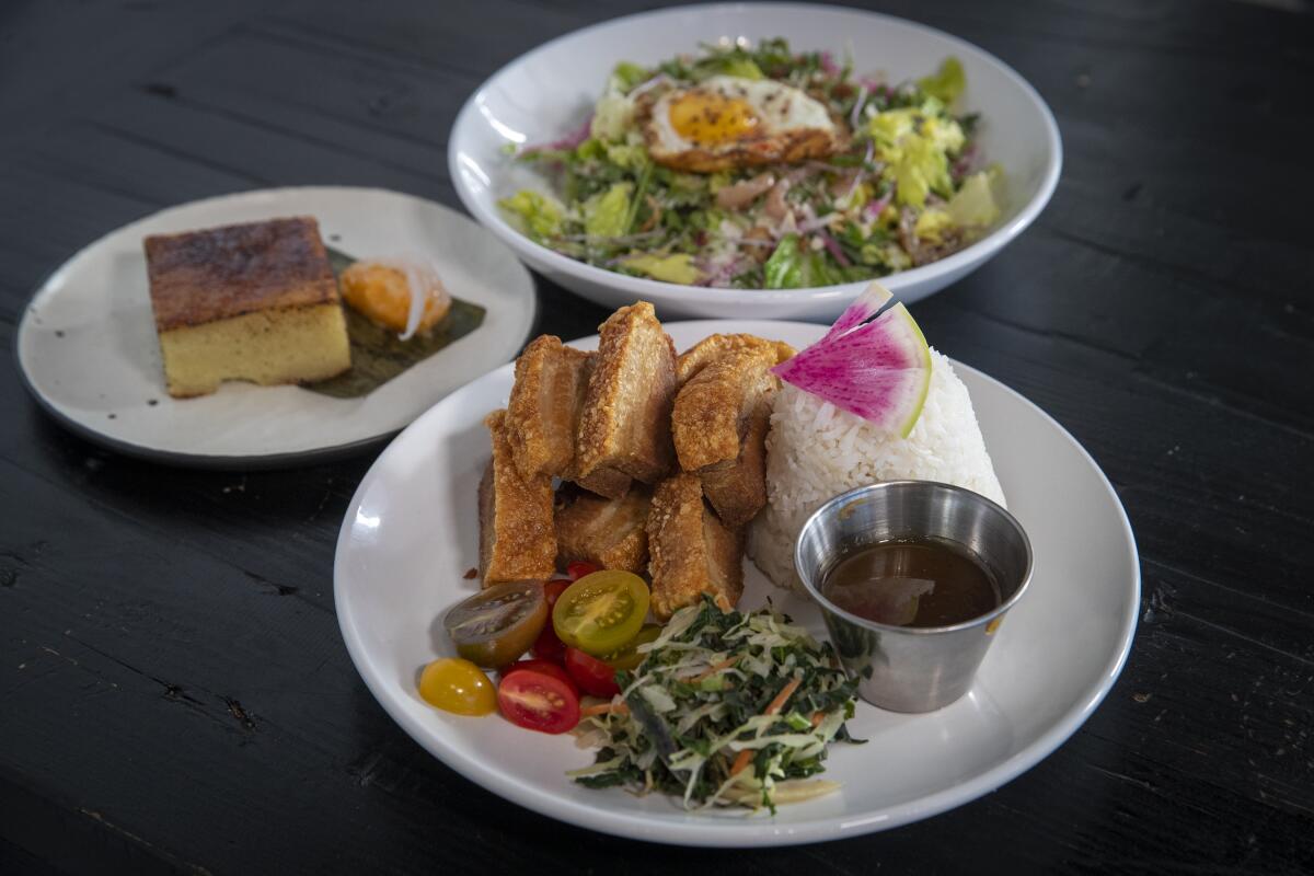 Maharlika salad, lechon kawali and bibingka brûlée at Bebot Filipino Soul Food in Long Beach.