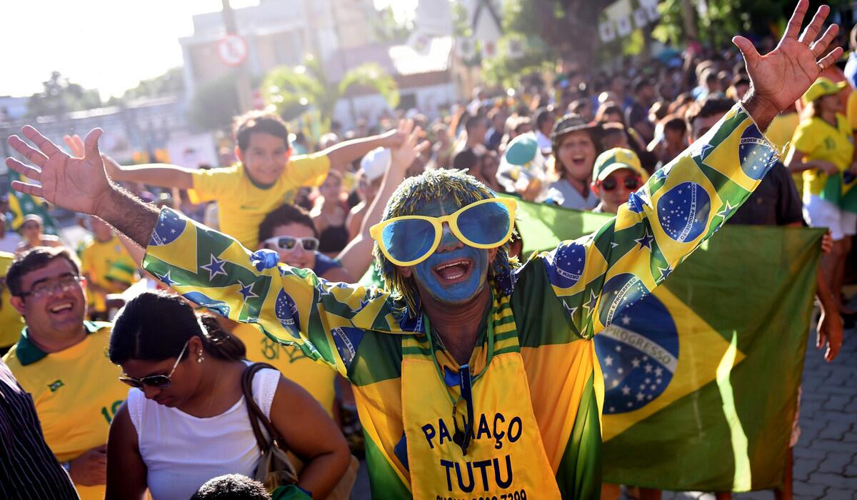 Brazil fans gather outside the stadium in Fortaleza during a training session on Thursday.