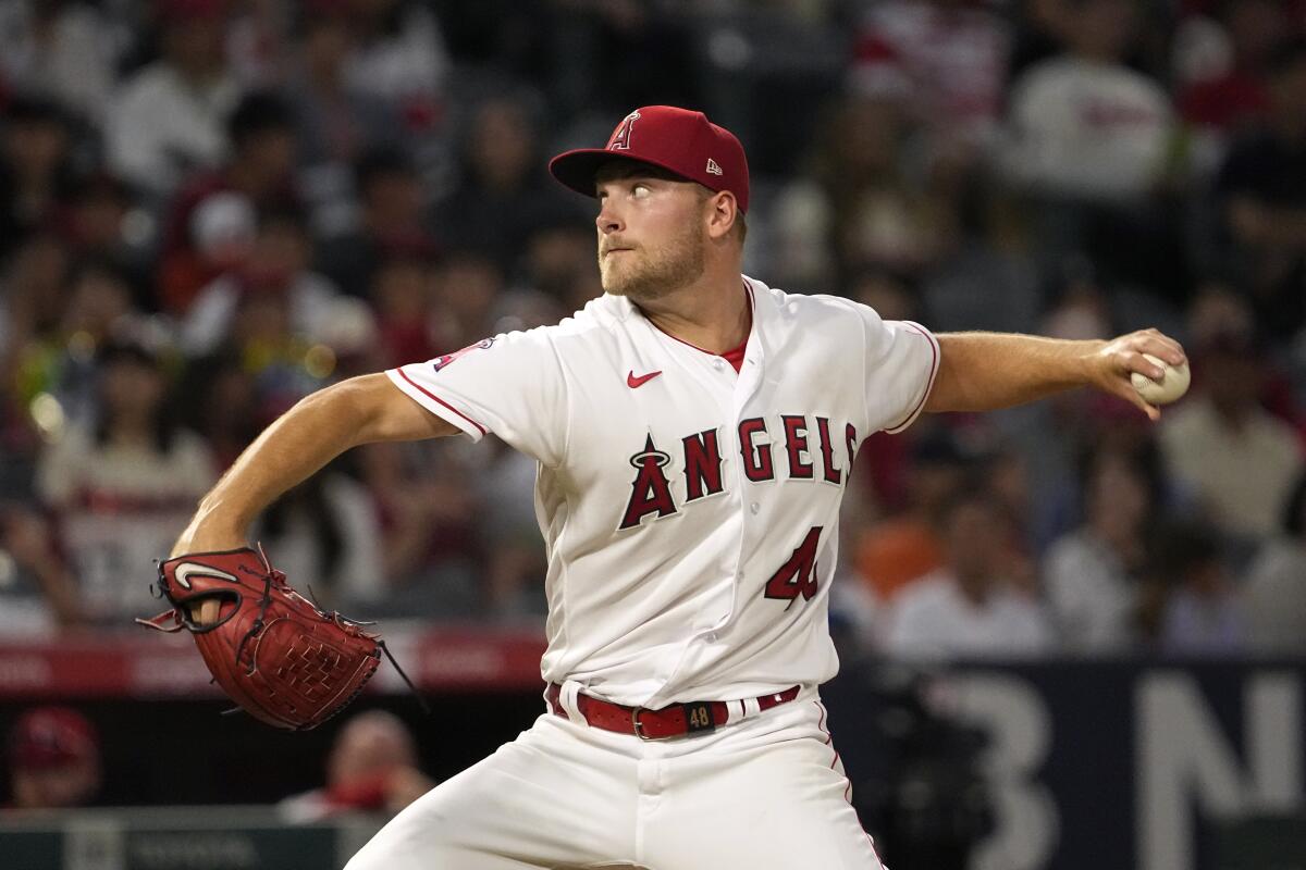 Los Angeles Angels starting pitcher Reid Detmers throws to the plate during the third inning.