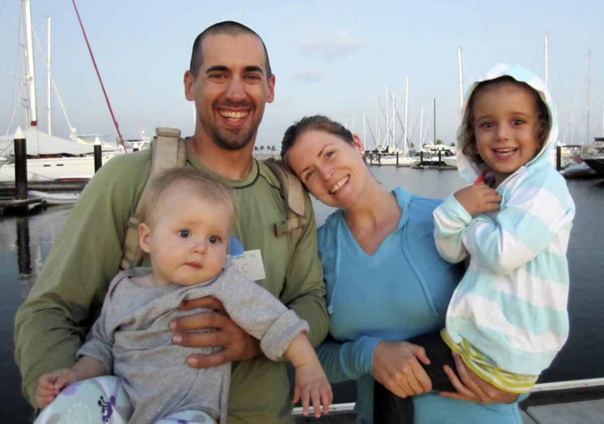 Eric and Charlotte Kaufman with daughters Lyra, left, and Cora. The Kaufmans have defended their decision to take the girls on a round-the-world sailing voyage that was cut short when Lyra became ill. The family was rescued by the Coast Guard, Navy and California Air National Guard.