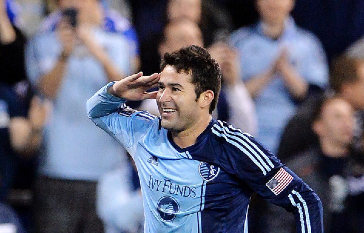 Sporting Kansas City's Claudio Bieler salutes the fans after scoring the only goal of the game against D.C. United in an MLS game earlier this month.