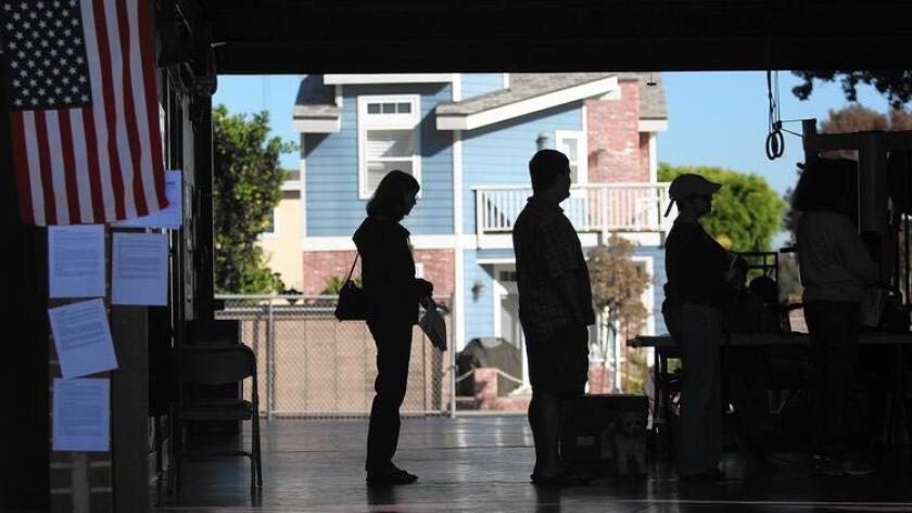 Voters in Newport Beach on election day in 2014. A new California law allows voters to register on election day at any polling place. (Los Angeles Times)