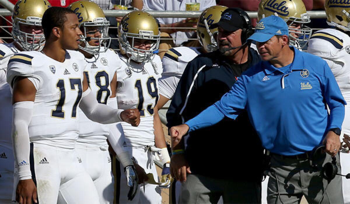 UCLA quarterback Brett Hundley (17) and Coach Jim Mora faced plenty of pressure beginning with preseason expectations of a Heisman Trophy candidacy and College Football Playoff run.