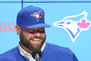 Toronto Blue Jays manager John Schneider smiles during a press conference in Toronto on Friday, Oct. 21, 2022. The Toronto Blue Jays and manager John Schneider have agreed to terms on a three-year contract with a team option for the 2026 season, the club announced Friday. (Nathan Denette/The Canadian Press via AP)