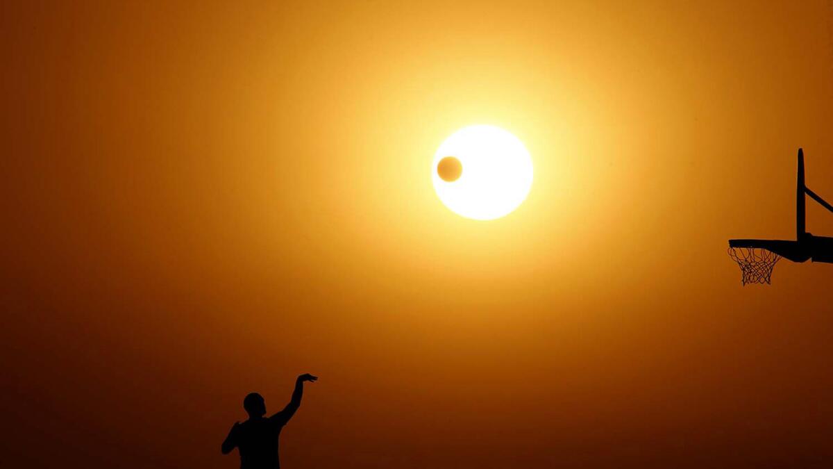 The sun sets Thursday on the autumnal equinox, the first day of fall, at Angels Gate Park in San Pedro.