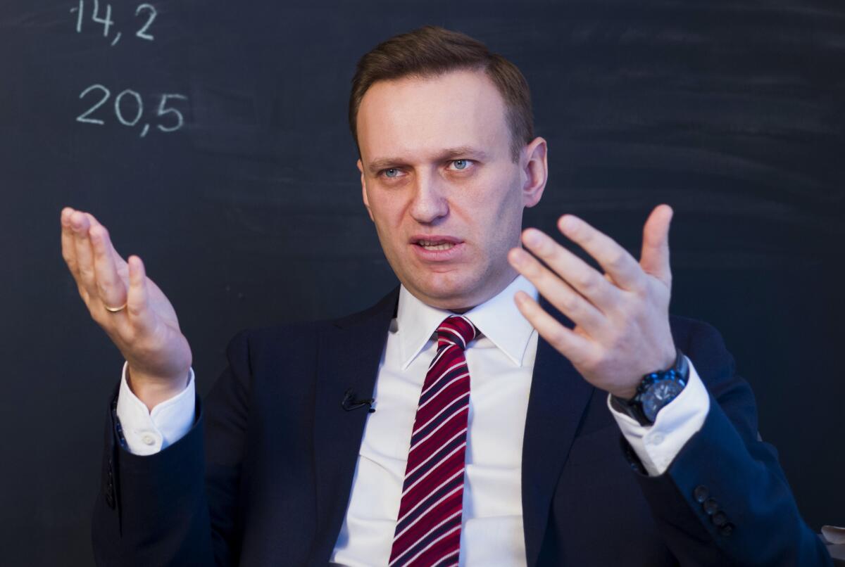 Russian opposition politician Alexei Navalny gestures while speaking during his interview.