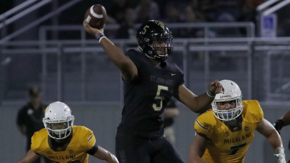 Bosco quarterback D.J. Ulagalelei throws downfield against Mililani.