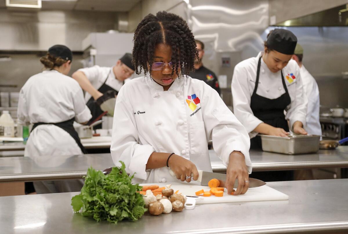 Anaya Green, a freshman in the Culinary Arts Academy, works at her station at the Orange County School of the Arts.