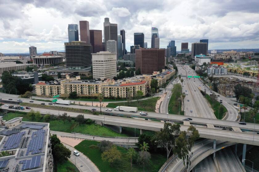 LOS ANGELES, CALIFORNIA-MARCH 19, 2020-The intersection of the 101 and 110 freeways in downtown Los Angeles on March 20, 20230. The city of Los Angeles is on lockdown due to the Coronavirus after Govenor Newsom requested that all non-essential business be stopped and people stay home. (Carolyn Cole/Los Angeles Times)