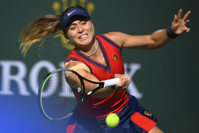 Paula Badosa, of Spain, hits the ball while playing Victoria Azarenka, of Belarus, in the singles final.