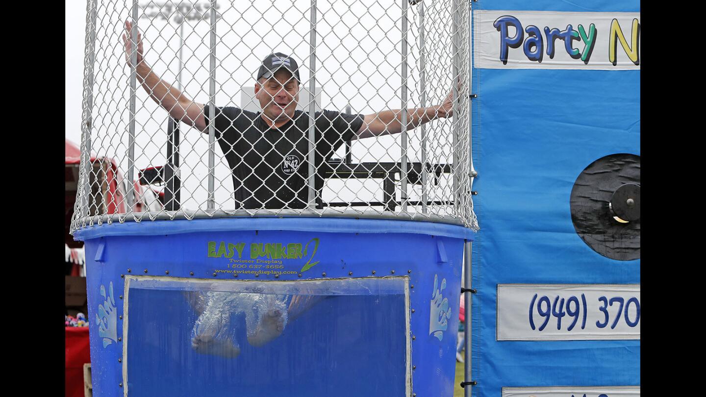 Huntington Beach Police Chief Rob Handy goes down in the Dunk Tank during an Easter event hosted by the Kiwanis Club of Huntington Beach on Saturday, March 31.
