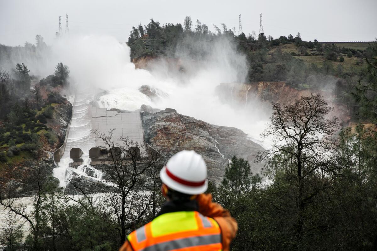 With a reduced flow on Sunday, most of the water being released from the Oroville Dam is not going down the spillway; it has broken through and is flowing down the hillside.