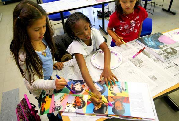 Ashley Sotelo, from left, Airiana Henderson and Emely Garcia pick their favorite Warhol style to copy.