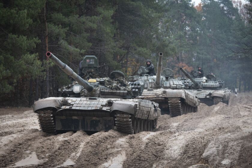 FILE - Ukrainian soldiers on captured Russian tanks T-72 hold military training close to the Ukraine-Belarus border near Chernihiv, Ukraine, Friday, Oct. 28, 2022. (AP Photo/Aleksandr Shulman, File)