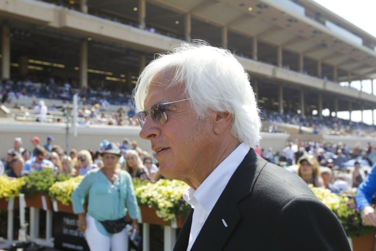 Bob Baffert in front of a racetrack grandstand