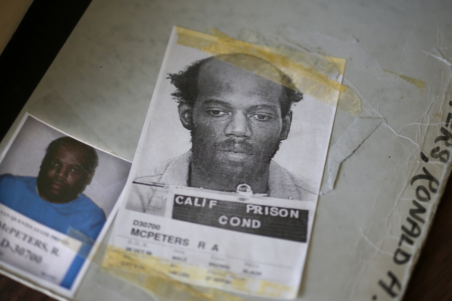 Yellowing tape residue stains the mugshot of condemned murderer Ronnie McPeters in the files at San Quentin State Prison.