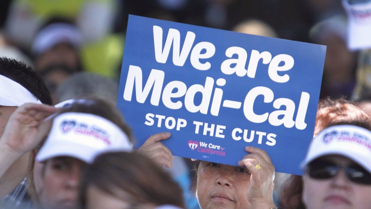 Demonstrators rally against cuts in the amount the state pays for Medi-Cal provider payments in Sacramento in 2013. (Rich Pedroncelli / AP)
